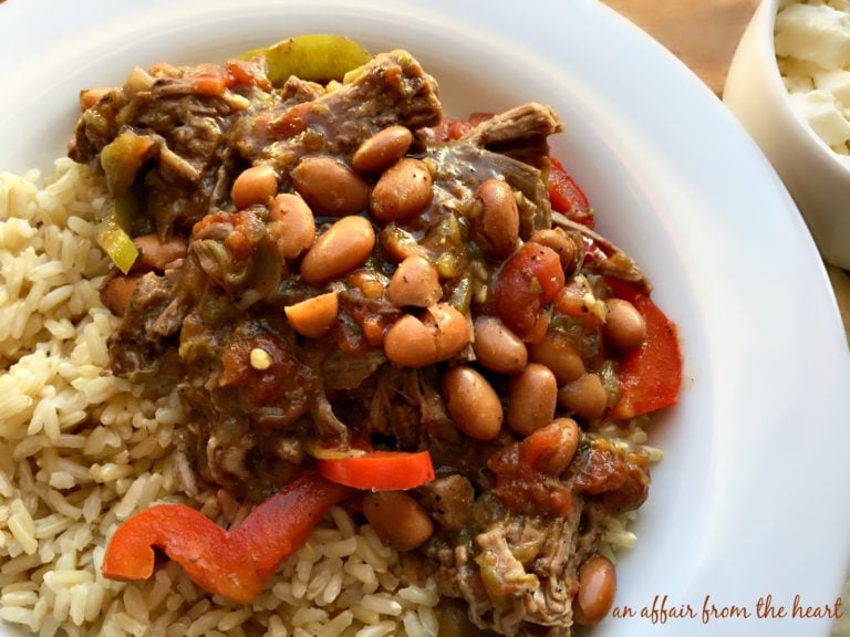 Close up of Crock Pot Spicy Steak & Beans in a white bowl