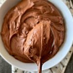 Close up of Sour Cream Chocolate Frosting on a spoon