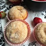 close up of muffins with text "Strawberry Cheesecake Muffins"