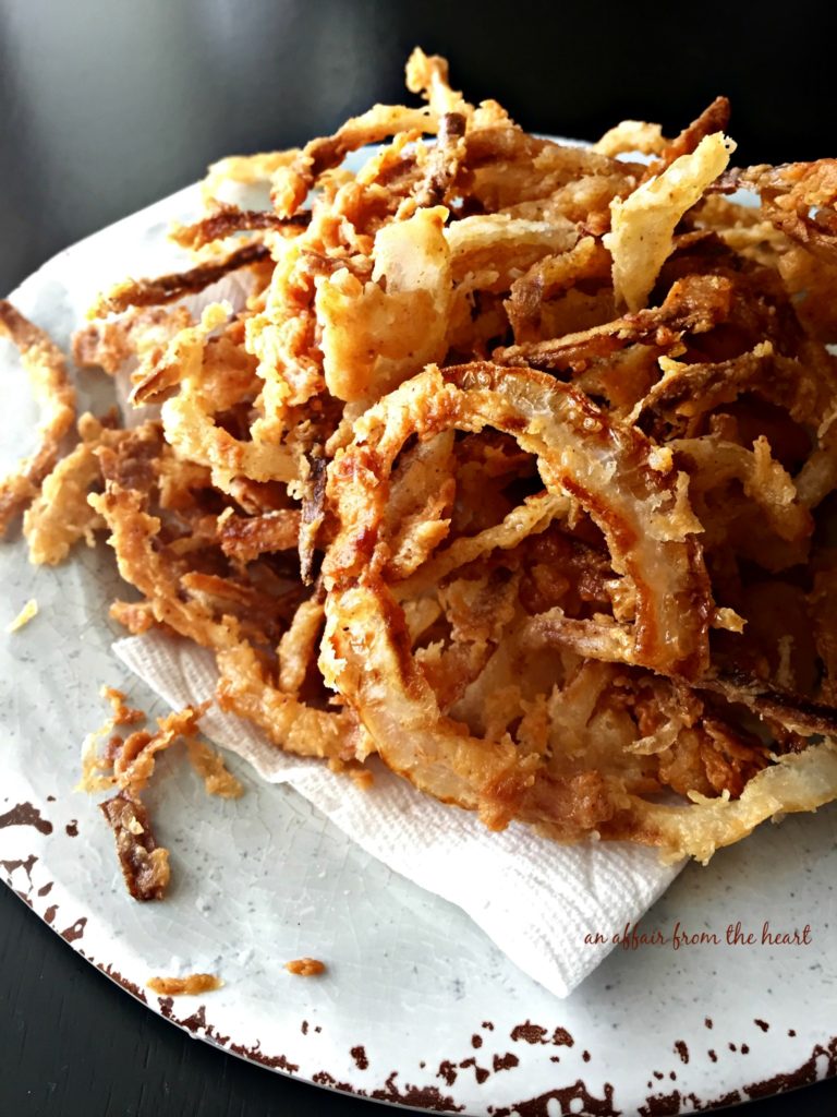 Homemade Onion Strings on light blue plate