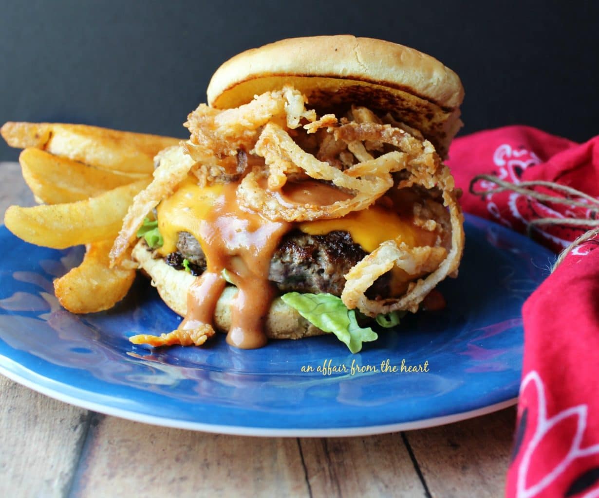 side view of Western Burger on a blue plate