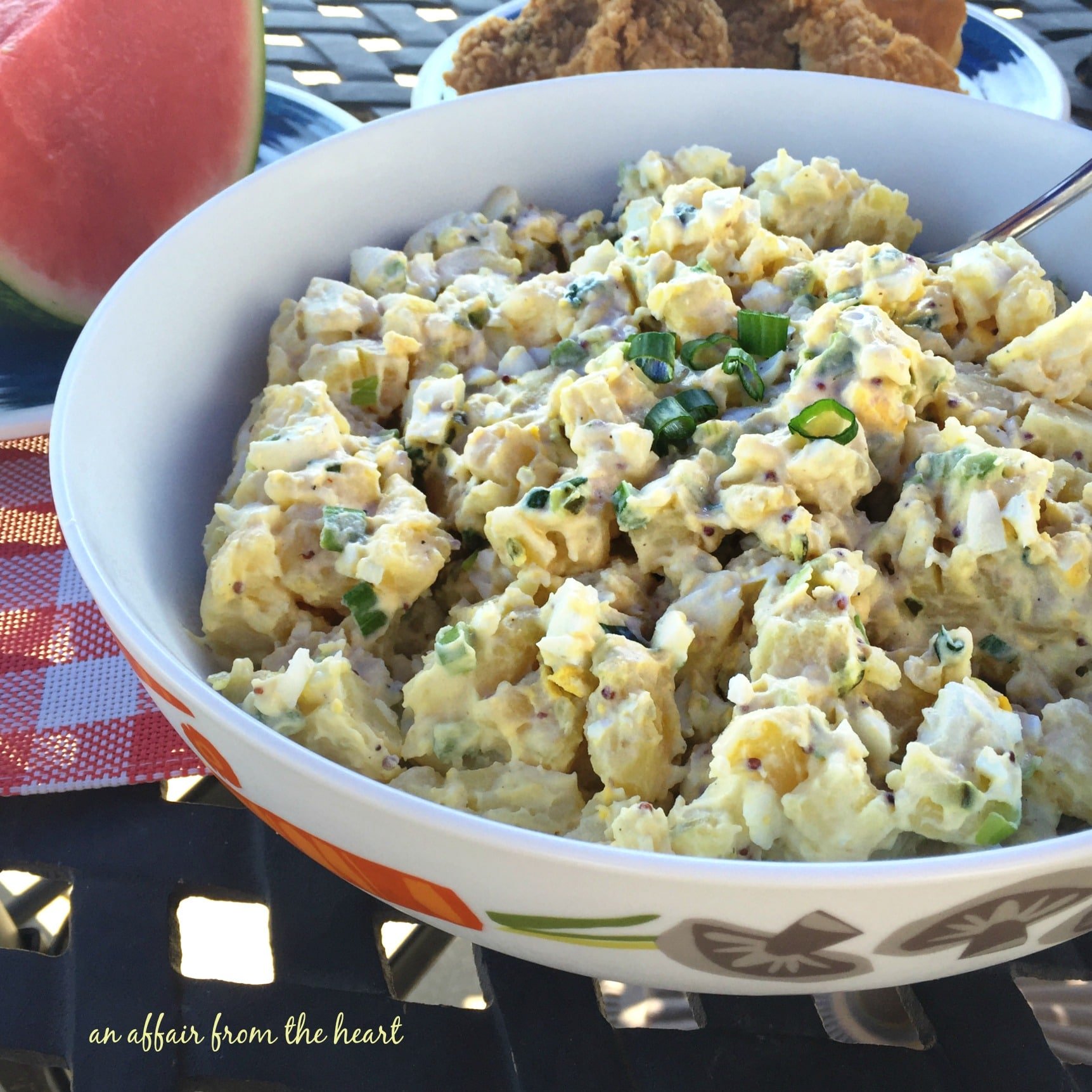 close up of Picnic Potato Salad in a white serving bowl