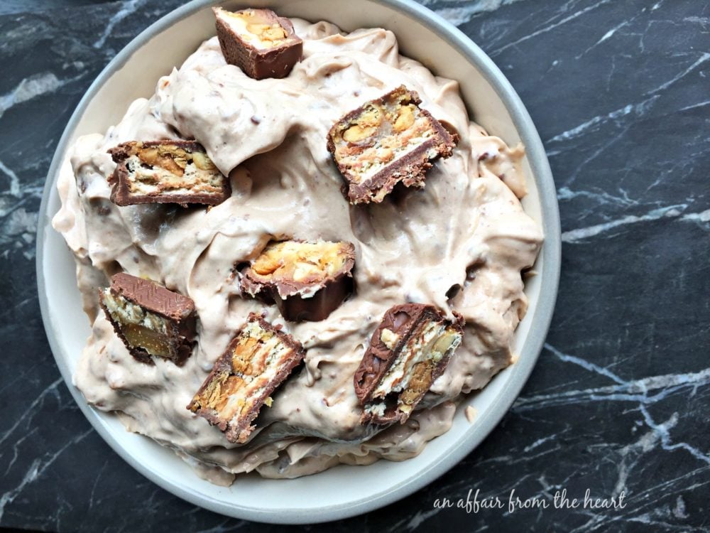 Overhead of Snickers Dip in a white bowl
