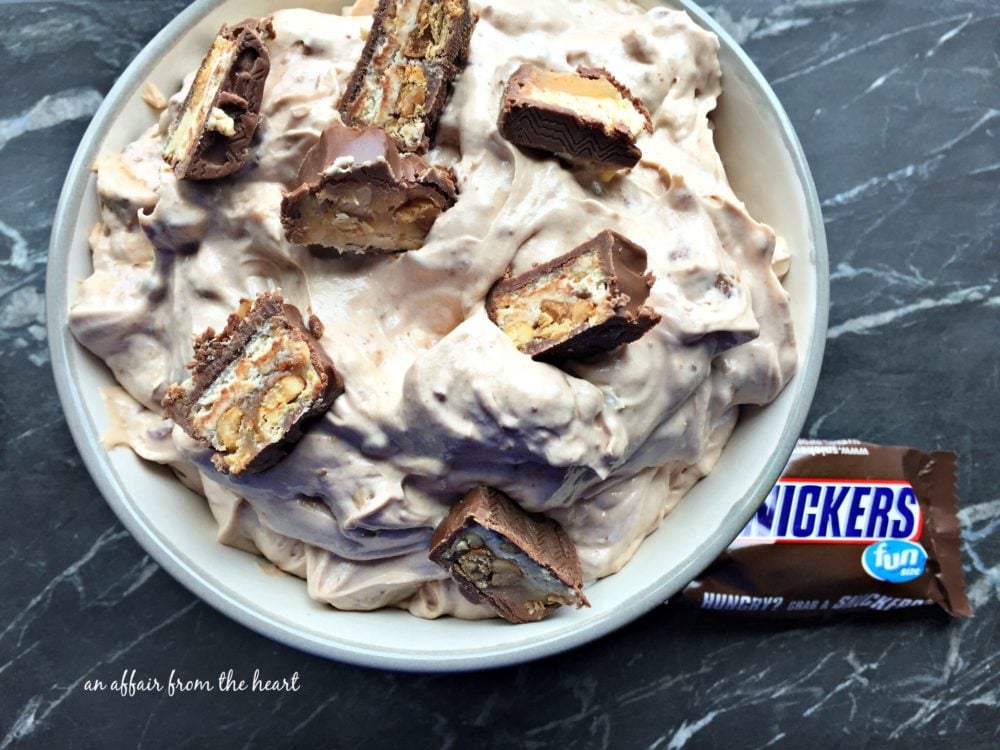 Close up of Snickers Dip in a white bowl