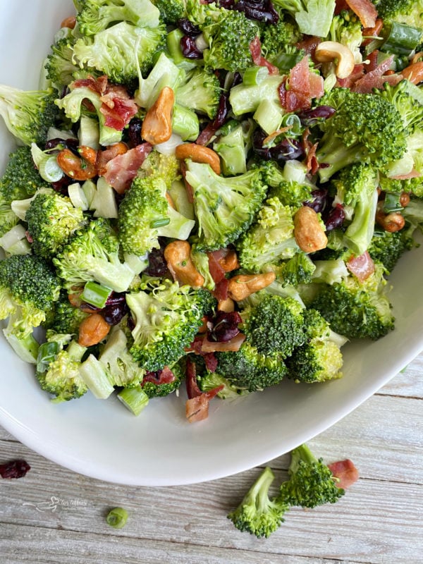 Top view of broccoli in bowl with cashews