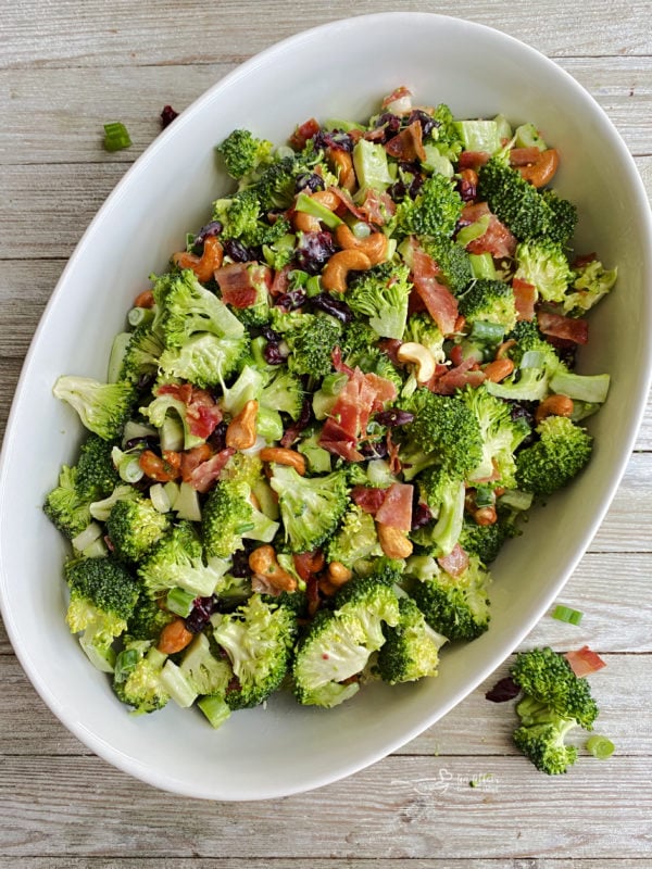 One bowl filled with bacon cashew broccoli salad