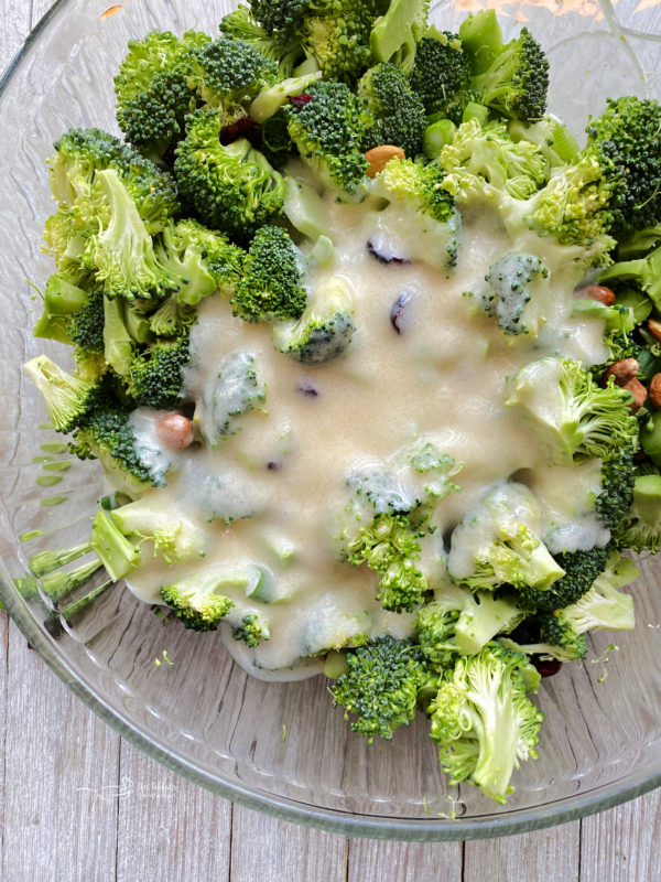 dressing in bowl with broccoli