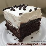 Close up of Chocolate Pudding Poke Cake on a white plate