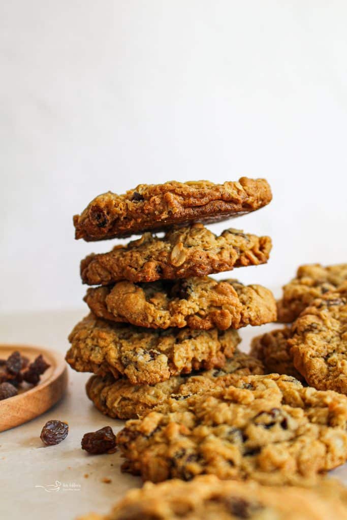 Grandma Jane's Oatmeal Raisin Cookies stacked on a table.