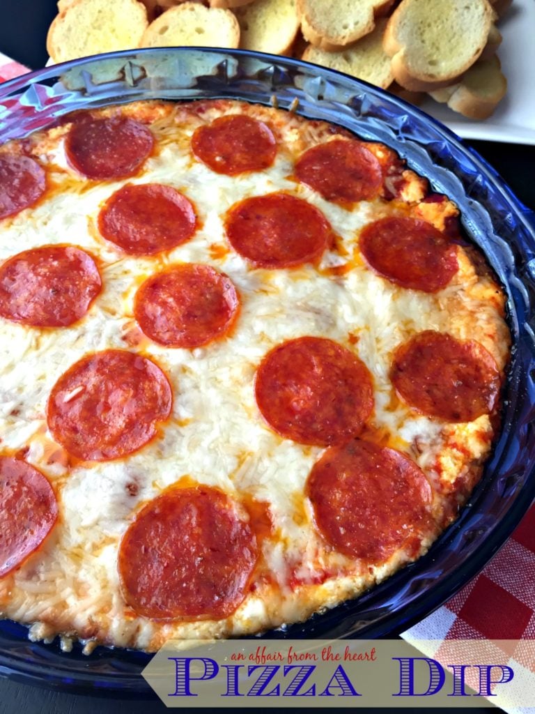 Pizza Dip in a blue dish with text "pizza dip"