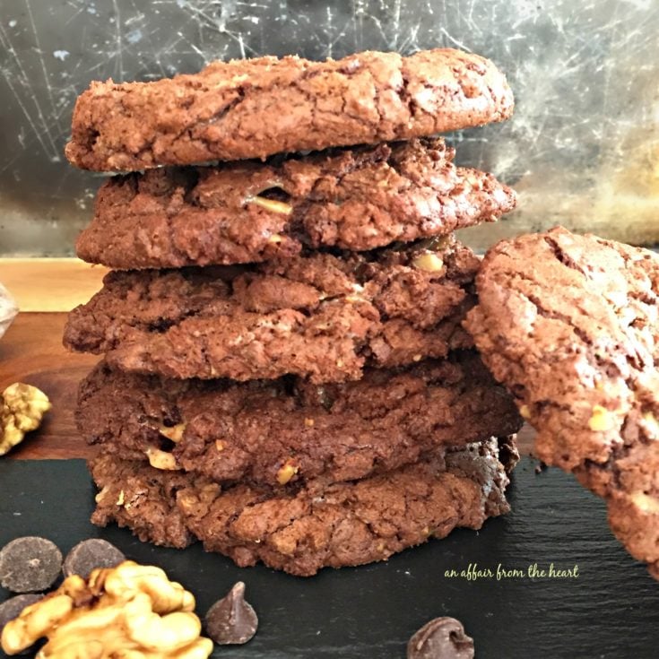 Close up, side view of giant-chocolate-toffee-cookies stacked on a table