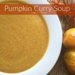Close up of soup in a white bowl with text "Pumpkin Curry Soup"