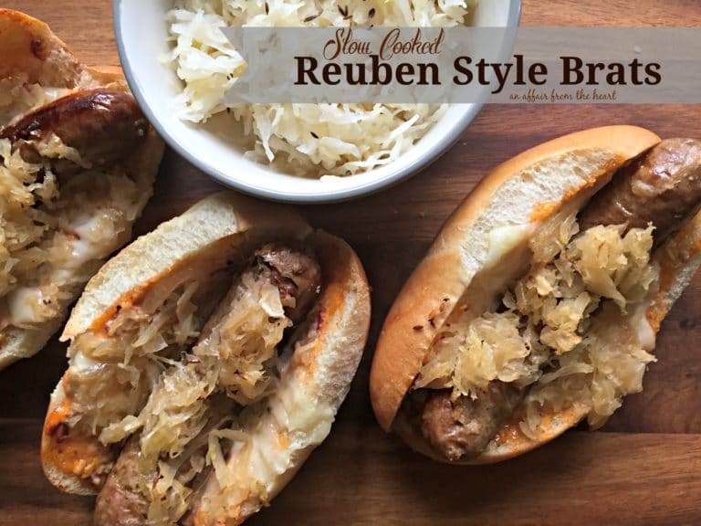 overhead of 3 brats and a bowl of kraut with text "Slow Cooked Reuben Style Brats"