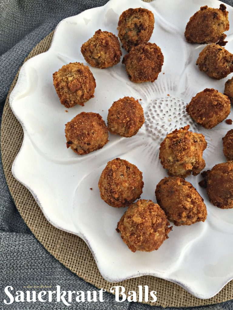 Sauerkraut Balls on a white serving dish with text "Sauerkraut balls"