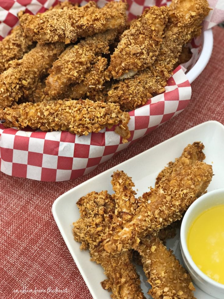 Spicy Baked Chicken Tenders in a basket and on a white plate