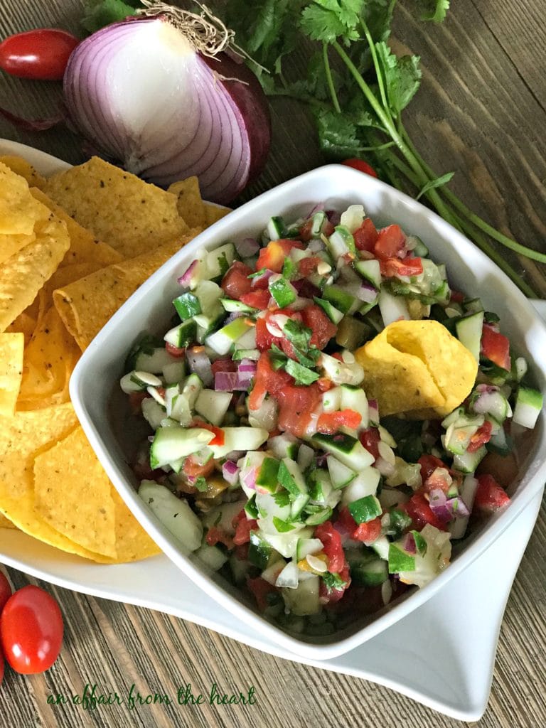 overhead of cucumber salsa in a white bowl