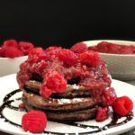 Side view of Chocolate Pancakes with Raspberry Sauce