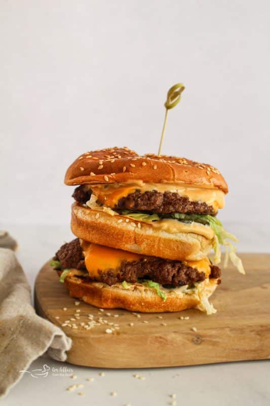 Close up of Homemade Big Mac on a cutting board.