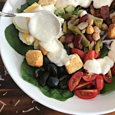 Loaded Spinach Salad with Creamy Roasted Garlic Dressing