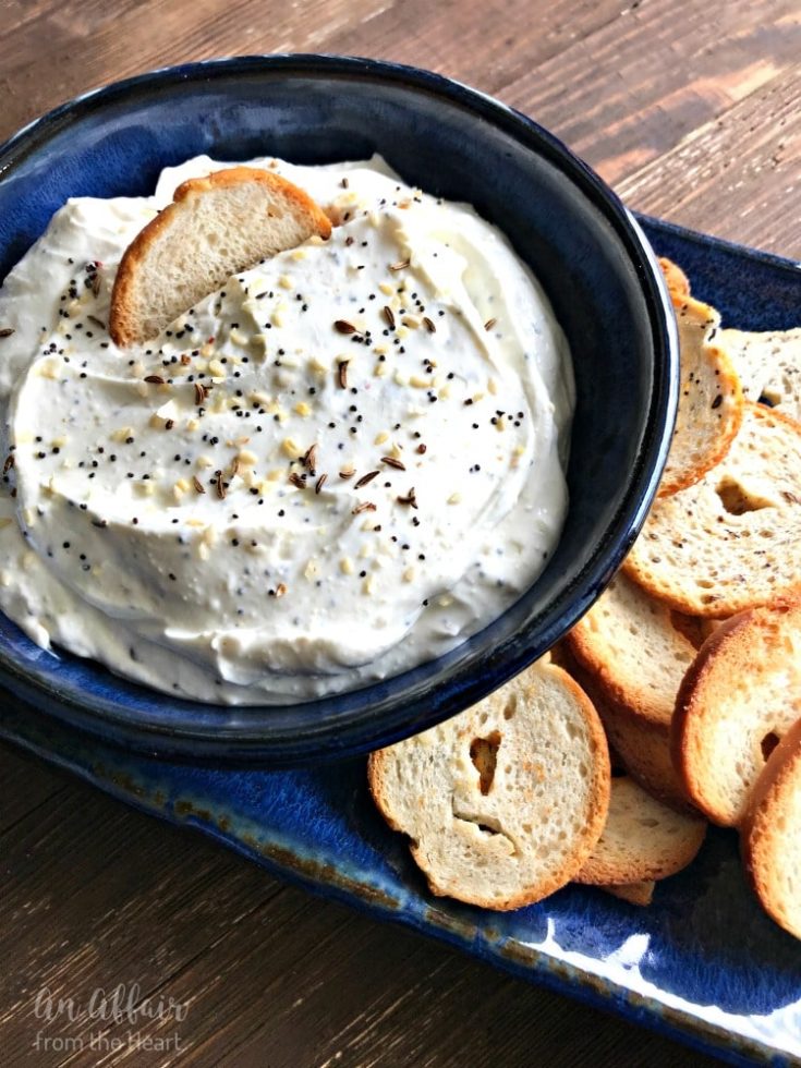 Everything Bagel Dip in a blue bowl