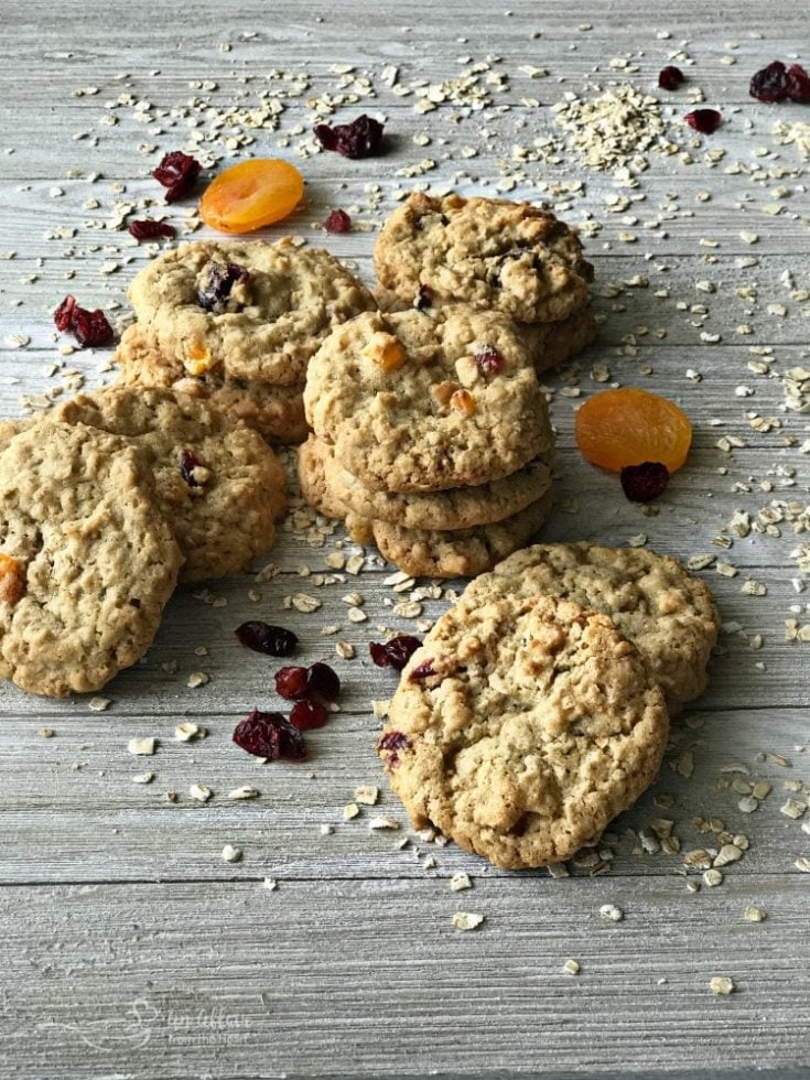 Cranberry Apricot Oatmeal Cookies stacked on a wood table