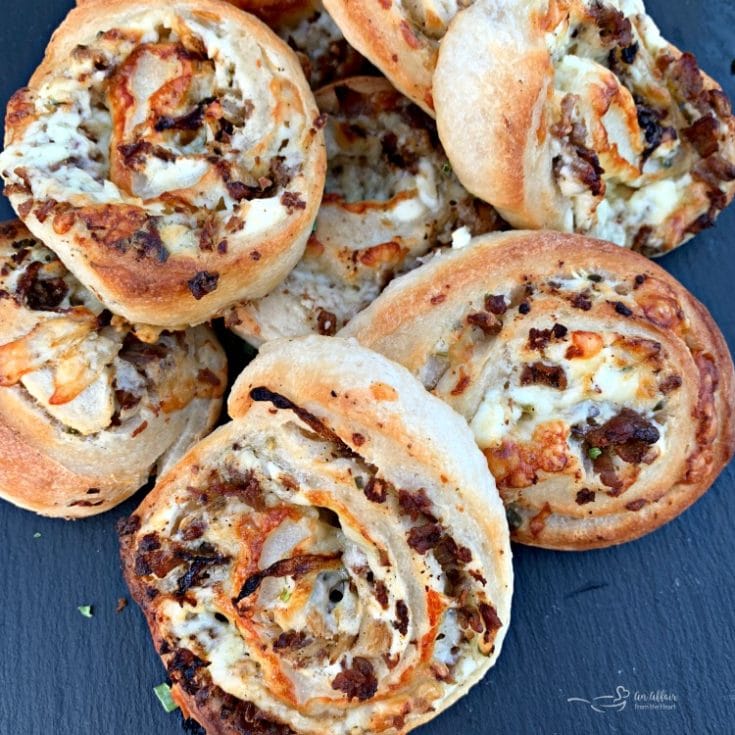 Close up of Steak & Kraut Pinwheels with Caramelized Onions and White Cheddar Cheese