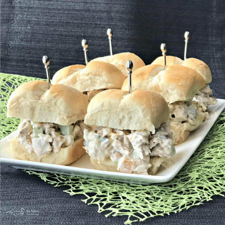 Side view of Leftover Turkey Salad sliders on a white plate