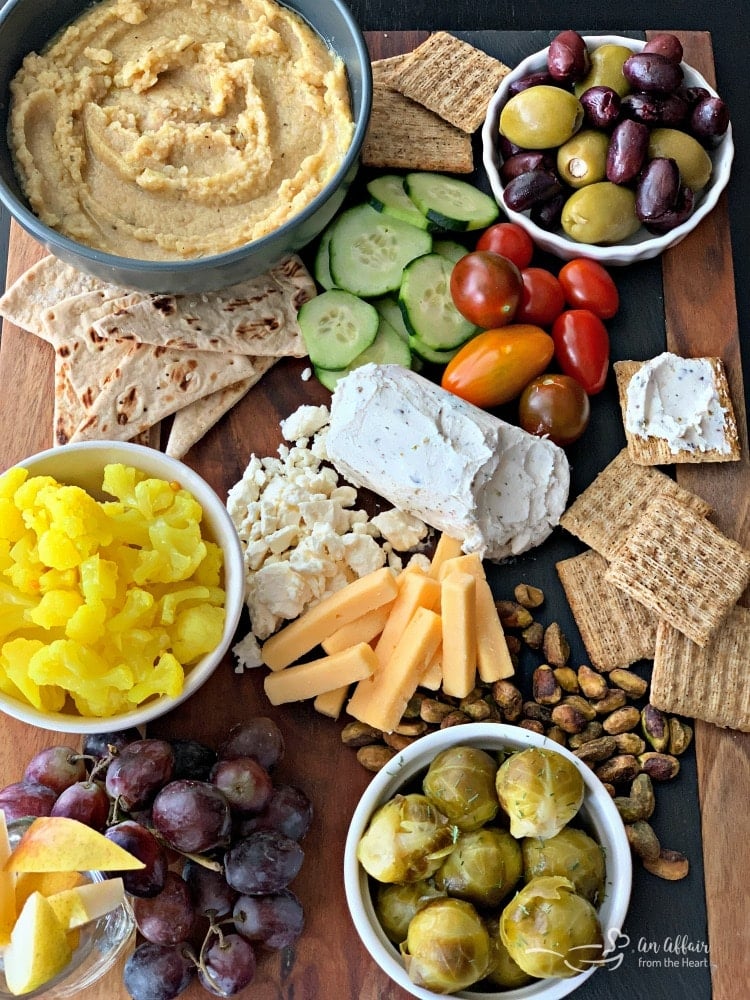 overhead of Mediterranean Inspired Cheeseboard with Cauliflower Hummus