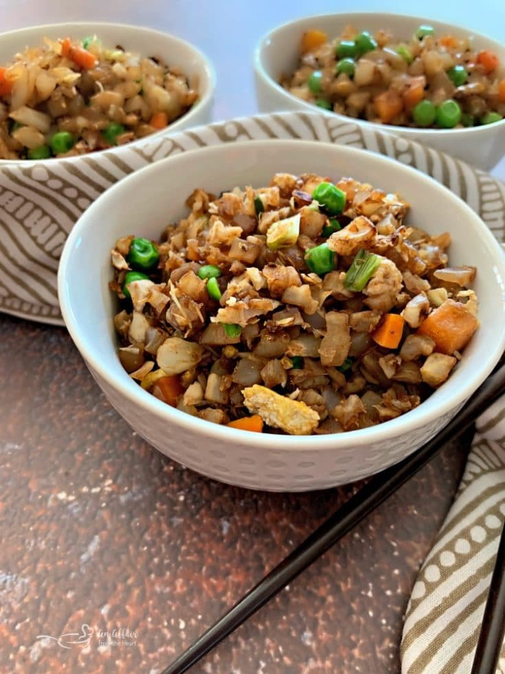 Side view of Cauliflower Fried Rice in a white bowl