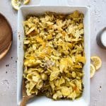 Scooping the Tuna Tetrazzini out of the casserole dish.