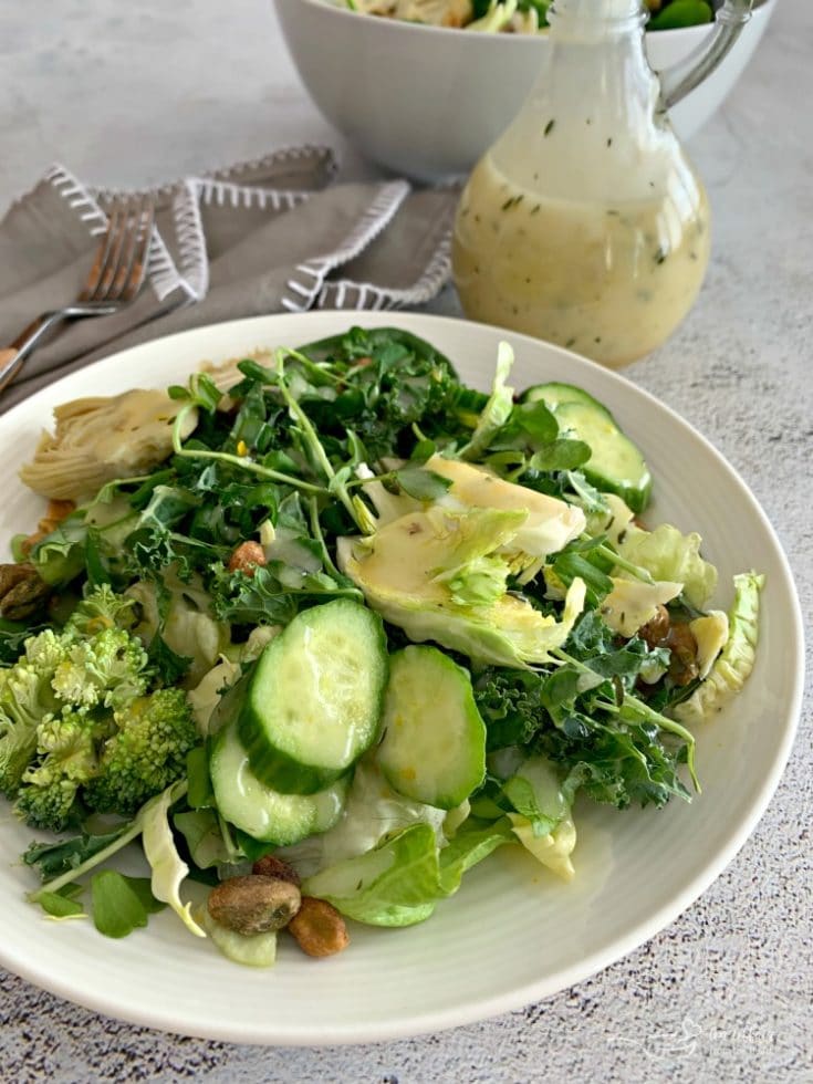 Green Salad with Lemon Thyme Vinaigrette on a white plate