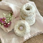 Baked Powdered Sugar Donuts stacked on a white napkin