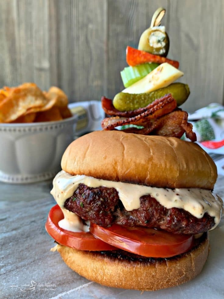 Bloody Mary Burger with garnish on grey platter