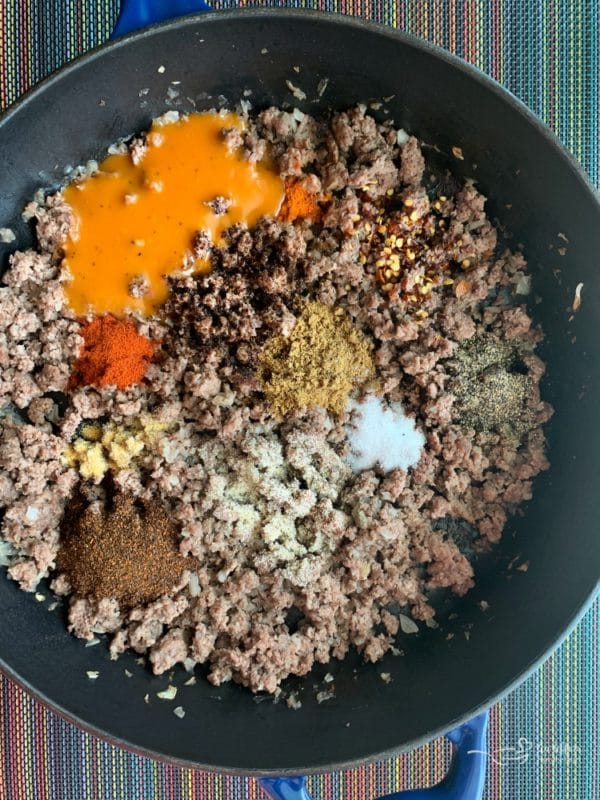 Taco Salad with Dorothy Lynch Taco Sauce prepping meat