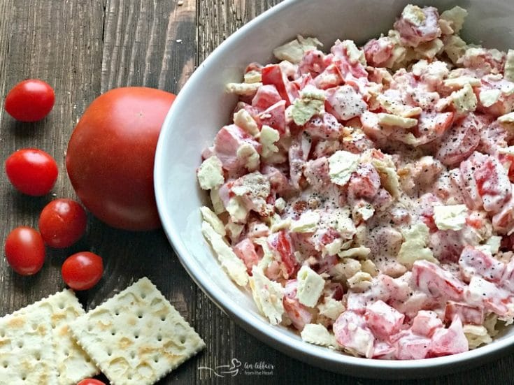 close up of Tomato Cracker Salad in a white bowl