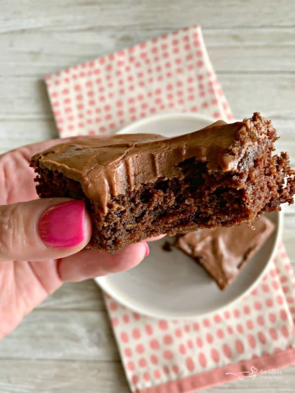 Frosted Zucchini Brownies bite out of it