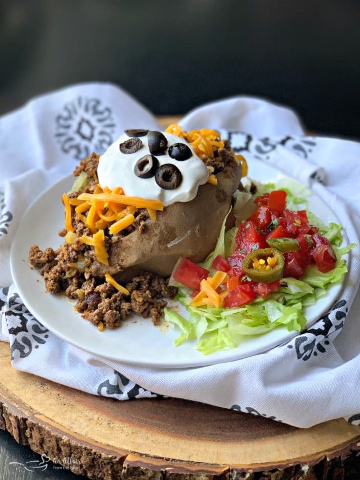Taco Loaded Baked Potato Baked potatoes with taco meat and toppings.