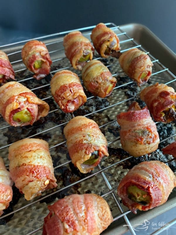 Bacon Wrapped Hot Brussels Sprouts prepared on a cookie sheet in the oven