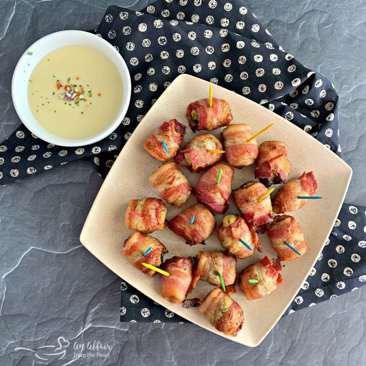 Bacon Wrapped Hot Brussels Sprouts with smoked white cheddar cheese sauce