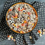 Overhead of Halloween Double Peanut Butter Muddy Buddies in a halloween bowl