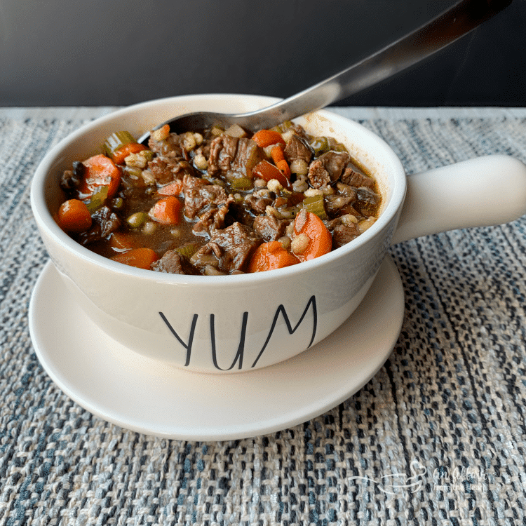 Instant Pot Vegetable Beef Soup in a white soup mug