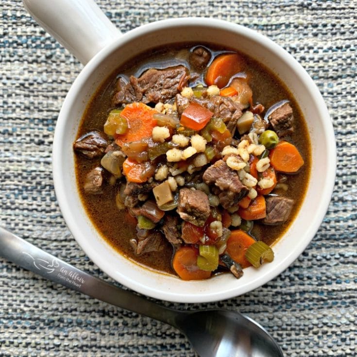 overhead of Instant Pot Vegetable Beef Soup in a white mug