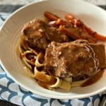 Braised Beef Short Ribs with Red Eye Gravy in a white bowl