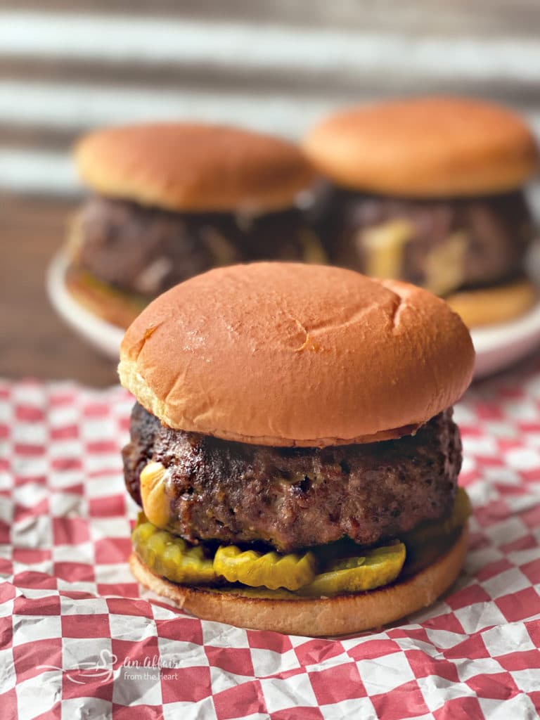 Jucy Lucy Burgers on red and white check paper