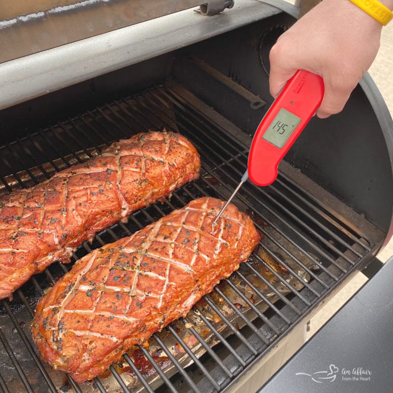 pork loin on grill checking temperature