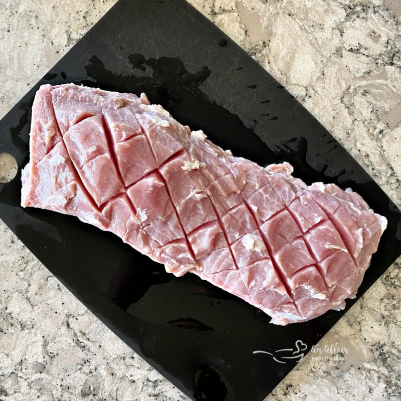 pork loin raw on a cutting board