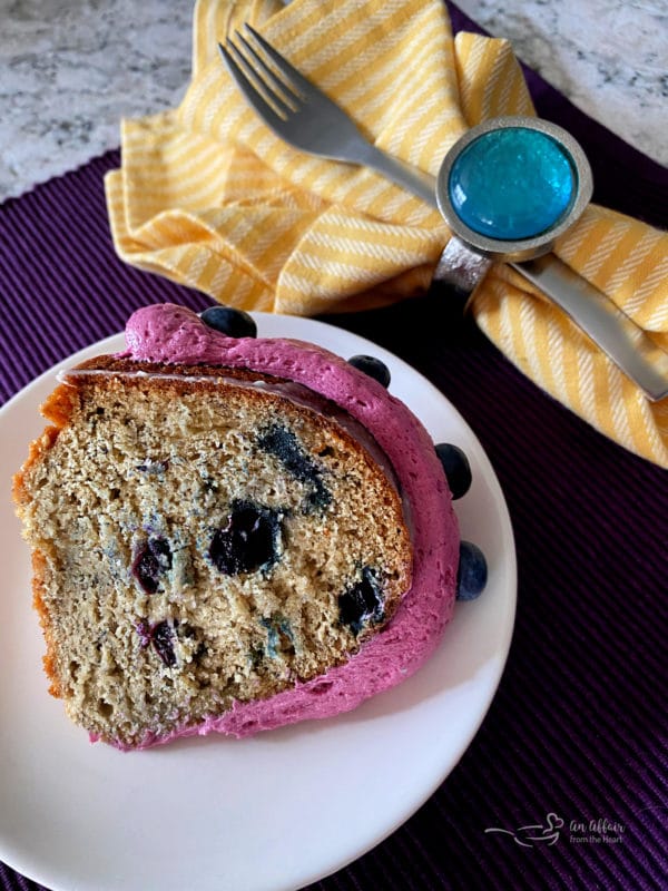 overhead of Blueberry Banana Bundt Cake slice on a white plate