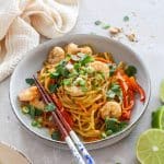 Pad Thai Wonderpot in a bowl with chops sticks leaning on the bowl.