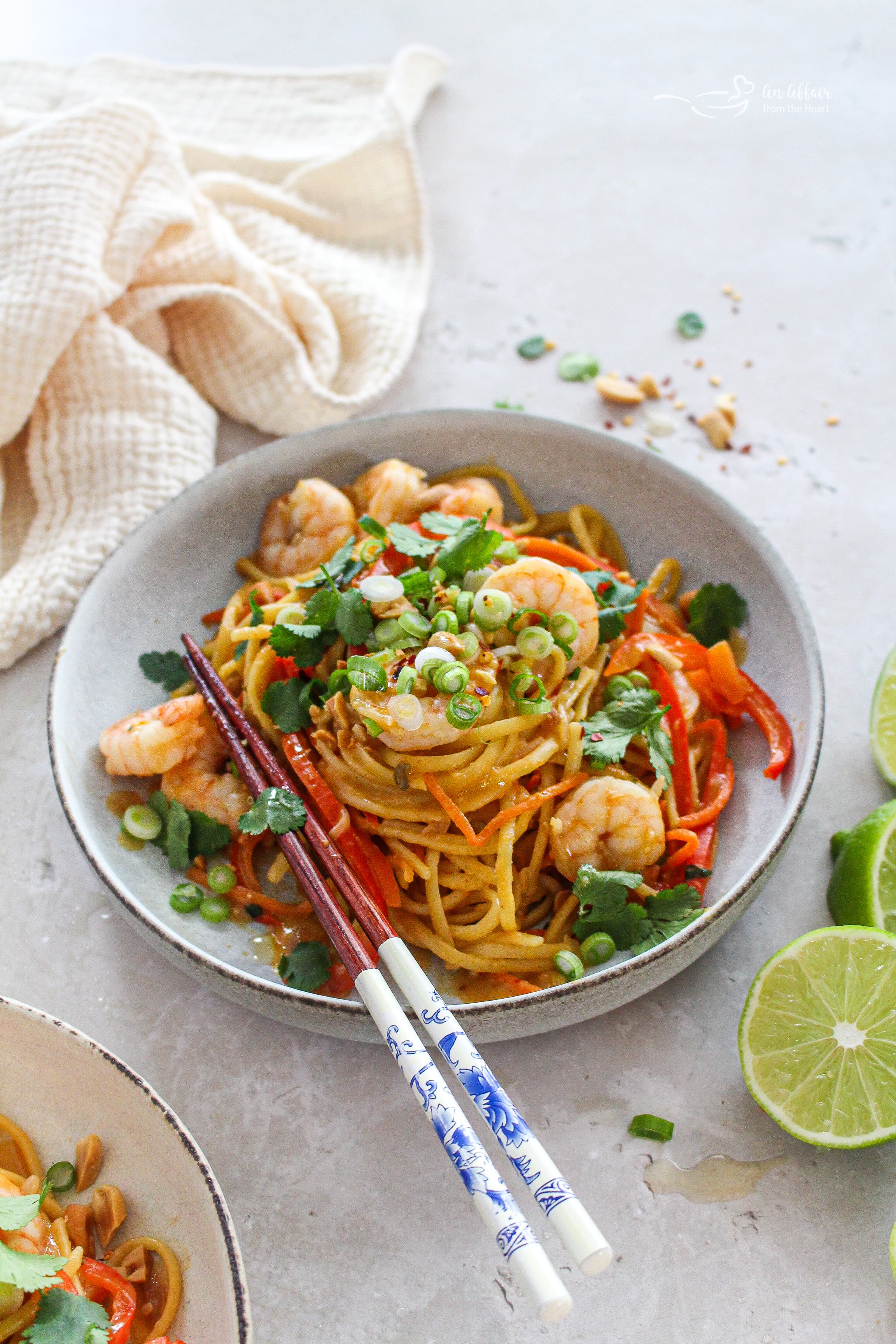 Pad Thai Wonderpot in a bowl with chops sticks leaning on the bowl.