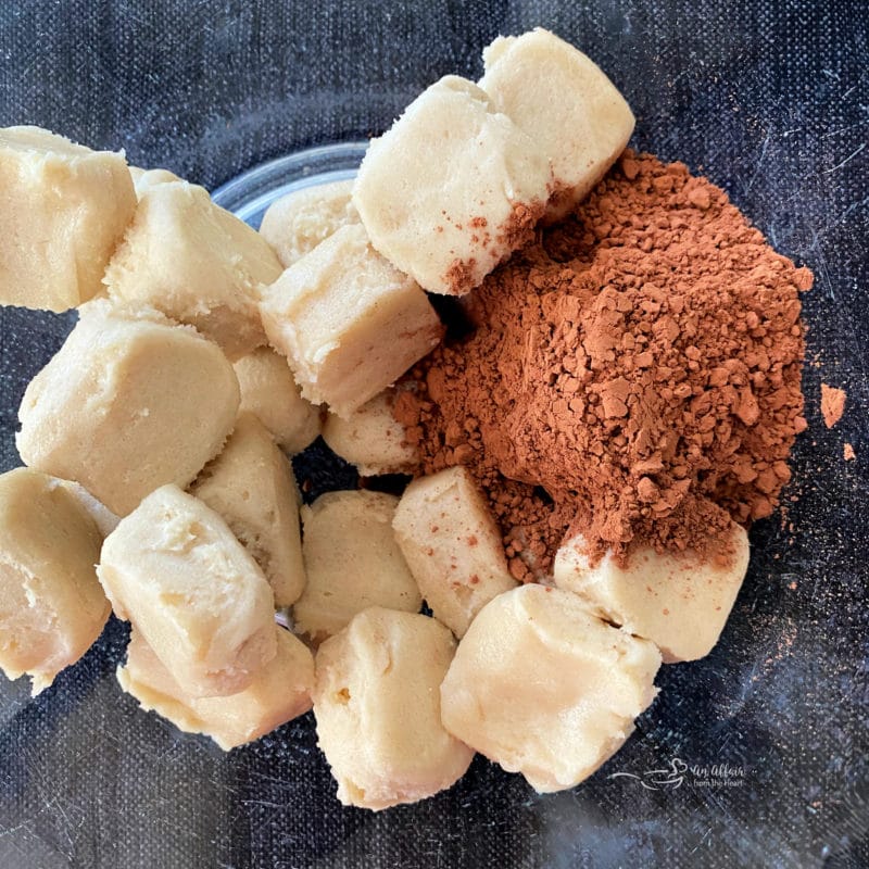 Preparing Halloween Chocolate Sugar cookies dough and cocoa in a bowl